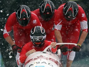 Pierre Lueders, Justin Kripps, Jesse Lumsden and Neville Wright of Canada compete during the four-man bobsleigh at the 2010 Vancouver Winter Olympics on Feb. 26, 2010 in Whistler, B.C.