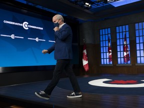 Former Conservative leader Erin O'Toole leaves the set following a news conference on Sept. 21, 2021 in Ottawa.