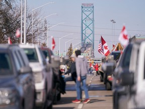COVID-19 mandate protesters block the roadway at the Ambassador Bridge border crossing with the U.S. in Windsor, Ont., on Feb. 9, 2022.