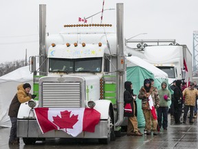 Truckers and supporters block the access leading from the Ambassador Bridge, linking Detroit and Windsor, on Feb. 11, 2022.