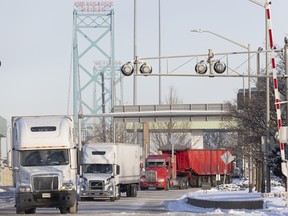 Traffic flows over the Ambassador Bridge in Windsor, Ont., on Feb. 14, 2022 after protesters blocked the major border crossing for nearly a week.