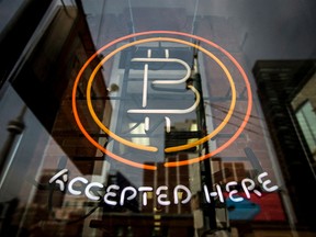 A Bitcoin sign in a window in Toronto.