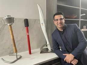 Usman Tahir Jutt pictured with his Canadian Olympic torch collection in Calgary.