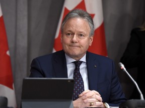 Former Bank of Canada Governor Stephen Poloz listens to a question at a press conference on Parliament Hill in Ottawa.