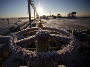 Ice on a valve control wheel connected to pipe work at a natural gas field in Russia.