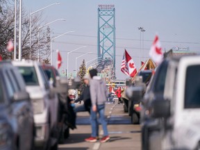 COVID-19 mandate protesters block the roadway at the Ambassador Bridge border crossing with the U.S. in Windsor, Ont., on Feb. 9, 2022.