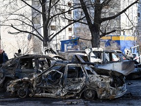 A view of the cars which were destroyed by recent shelling in Kyiv outskirts in Ukraine. The UN human rights chief said today that at least 102 civilians, including seven children, had been killed in Ukraine since Russia launched its invasion five days ago, warning the true numbers were likely far higher.