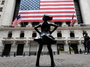 The fearless girl statue in front of the New York Stock Exchange.