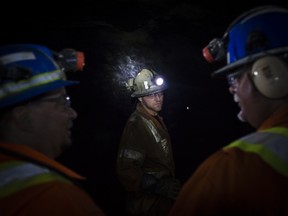 Gold miners underground at a site in Ontario.