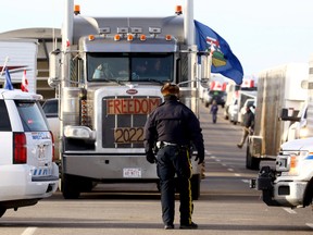 A road block on the highway headed toward the Coutts border crossing on Feb. 8.