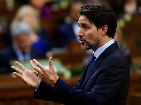rime Minister Justin Trudeau gestures as he speaks in parliament during Question Period in Ottawa, February 18, 2020.