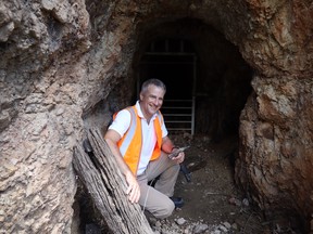 Queensland Gold Hill’s CEO at the entrance to the Big Hill Adit – the company is focused on gold discoveries in the historic mining districts of Queensland, Australia. SUPPLIED