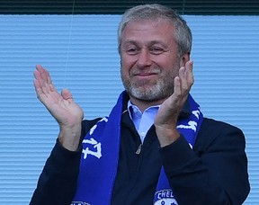 Chelsea's Russian owner Roman Abramovich applauds his team. Abramovich said Wednesday he has decided to sell Chelsea Football Club and promised to donate money from the sale to help victims of the war in Ukraine.