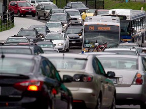 Motorists merge from four lanes into one as they enter the Lions Gate Bridge to drive into Vancouver, B.C. In just over a decade, gas-powered vehicles may be impossible to find in Canada.