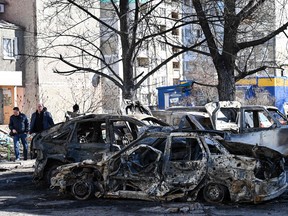 Cars which were destroyed by recent shelling on the outskirts of Kyiv, Ukraine, on Feb. 28, 2022.