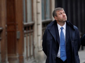 Chelsea Football Club owner Roman Abramovich walks past the High Court in London on Nov. 16, 2011.