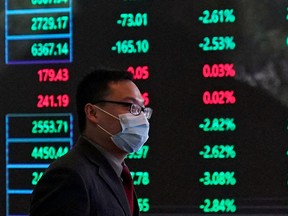 A man inside the Shanghai Stock Exchange building at the Pudong financial district in Shanghai, China.