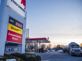 A gas tanker truck driver refills the Petro-Canada gas tanks in Prince Edward County.
