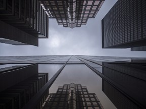 Bank buildings are photographed in Toronto's financial district on June 27, 2018. A new study says significant barriers continue to exist when it comes to hiring, retetaining and promoting Indigenous workers in Canada's banking and financial sector. qThe report from the Canadian Human Rights Commission is based on data from a 2018 survey of 36 employers including the country's six largest banks, Canada Pension Plan Investment Board and Export Development Canada.