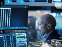 Traders work on the floor of the New York Stock Exchange.