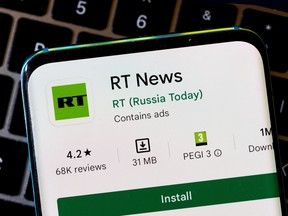 RT News app on a smartphone.