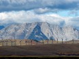 Windmills generate electricity in the windy rolling foothills of the Rocky Mountains near the town of Pincher Creek, Alberta.