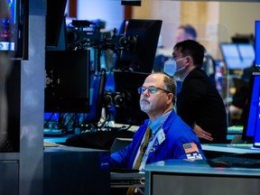 A trader works on the floor of the New York Stock Exchange.