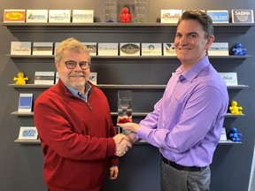 Richard Dyke, President, PAL Solutions, receiving the 2021 Partner of the Year Award from Jamie Veinot, Solutions Architect, SYSPRO Canada.