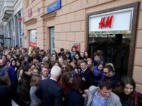 People queue outside the Swedish fashion retailer Hennes & Mauritz (H&M) store on its opening day in Moscow, May 27, 2017.