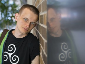 Vitalik Buterin poses for photos outside a blockchain competition at MaRs in Toronto, in 2017.