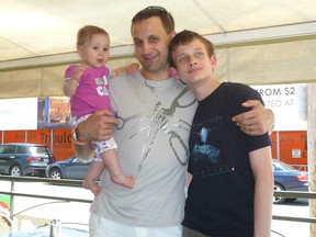 Dmitry Buterin, centre, with his son Vitalik, and daughter Misha.