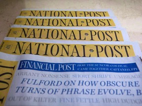 Copies of the National Post featuring the Financial Post.