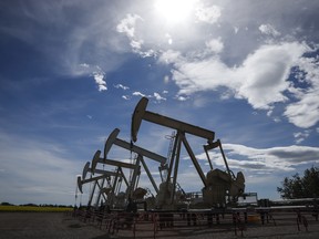 Pumpjacks draw oil out of the ground near Olds, Alta.
