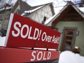 A for sale sign outside a home sold over the asking price in Ottawa.