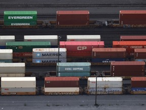 Shipping containers sit idle on railcars on November 20, 2021 in Surrey, British Columbia.