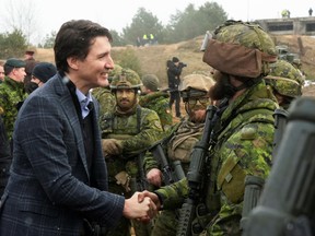 Prime Minister Justin Trudeau visits members of the Canadian troops, following the Russian invasion of Ukraine, in the Adazi military base, Latvia, March 8, 2022.