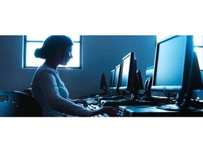032822-Woman-in-front-of-computers-250