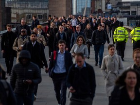 Commuters on London Bridge in London, U.K.