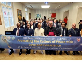 Dr. Hong, Tao-Tze, president of FOWPAL, first row, third from left, ambassadors to the UN (Vienna), and other visionaries celebrate the United Nations' designation of April 5 as the International Day of Conscience in Vienna, Austria on Oct. 10, 2019. (AP Images)