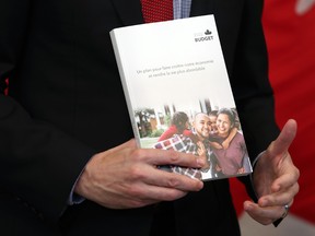 Justin Trudeau, Canada's prime minister, holds a copy of the federal budget in Ottawa on Thursday.