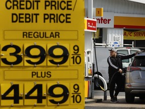 A person pumps gas in Washington, D.C., on April 11, amid high fuel prices.