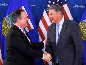 Alberta Premier Jason Kenney meets with U.S. Senator Joe Manchin in Calgary on April 12.