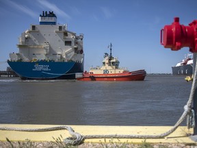 A tug boat pulls out an LNG Tanker vessel at the Cheniere Sabine Pass Liquefaction facility in Cameron, Louisiana, U.S., on Thursday, April 14, 2022.