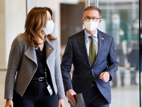 Bank of Canada governor Tiff Macklem and senior deputy governor Carolyn Rogers arrive to testify at a parliamentary finance committee meeting in Ottawa, on Monday.