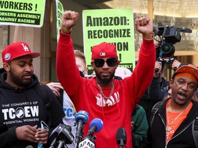Amazon Labour Union organizer Christian Smalls reacts as ALU members celebrate official victory after hearing results regarding the vote to unionize, outside the NLRB offices in Brooklyn, New York City.