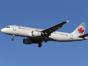 An Air Canada Airbus A320-200 airplane prepares to land at Vancouver's international airport in Richmond, B.C.