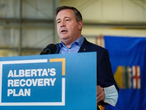 Premier Jason Kenney speaks at a press conference at STARS hangar on March 25, 2022.