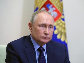 Russian President Vladimir Putin chairs a meeting with members of the Security Council at the Novo-Ogaryovo state residence outside Moscow on April 7, 2022.