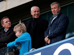 Chelsea's Russian owner Roman Abramovich, right, with Eugene Tenenbaum as they arrives to watch the English Premier League football match at Stamford Bridge in London on Jan. 19, 2014.