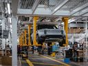 Rivian R1T electric vehicle pickup trucks move along the assembly line at the company's manufacturing facility in Normal, Illinois.